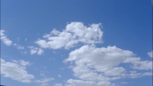 White Clouds Drifting on a Bright Blue Sky