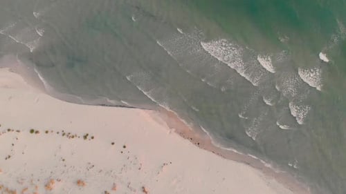 Aerial View of Waves Gently Hitting Beach