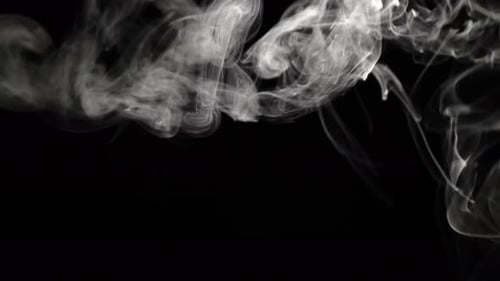 White Smoke Swirling on Black Background