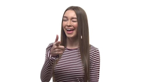 Smiling Woman Points at the Camera