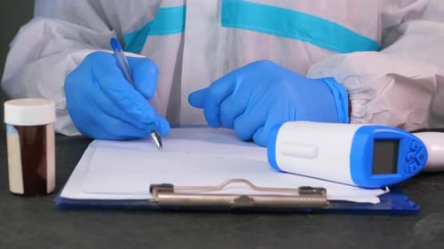 Hand Holding Infrared Thermometer To Measuring Temperature.