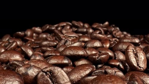 Dolly shot Close up of brown coffee beans.