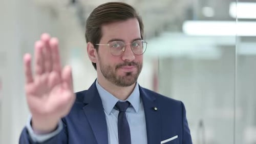 Man in Suit Gestures Stop With Hand
