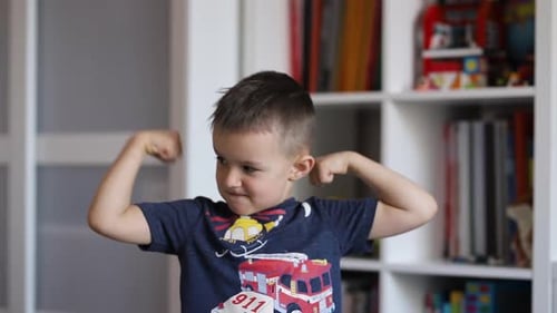 Smiling Boy Posing and Making Faces Indoors