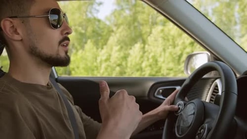 Man Driving Car on Road Trip During Day