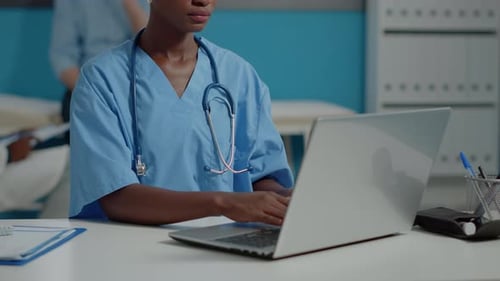 Close Up of African American Nurse Using Laptop Computer