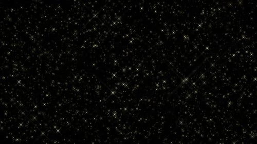 Golden Glittering Star Particles Background