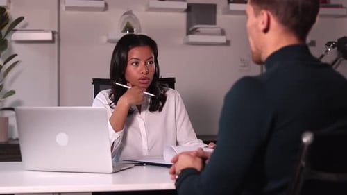 Woman and Man Interviewing in Office for Recruiting to Work with Staff Spbi