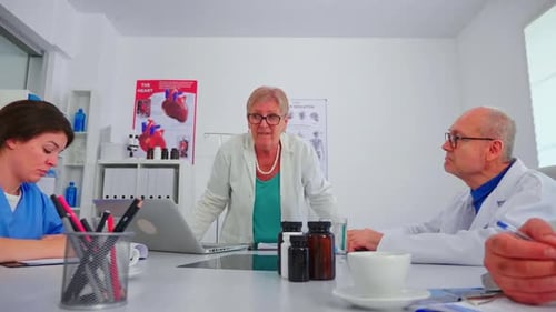 Doctors Meeting Collaboratively in Bright Medical Office