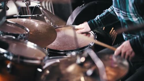 Young Music Band Member Playing Drums in the Record Studio