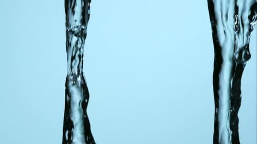 Water pouring and splashing in ultra slow motion 1500fps on a reflective surface - WATER POURS