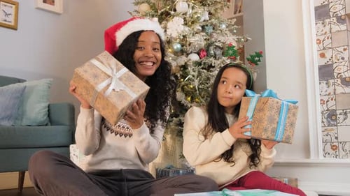 Two Girls Celebrate Christmas With Gifts