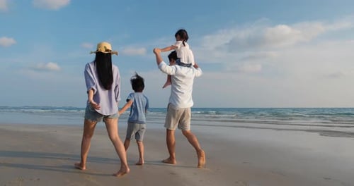 Family walking on the beach