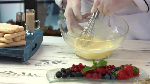 Preparing Dessert with Fresh Berries and Ladyfingers