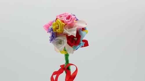 Crafty Ribbon Flower Bouquet Revolves on White Background