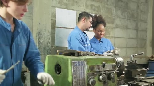 Professional workers teams work in the metalwork manufacturing factory.