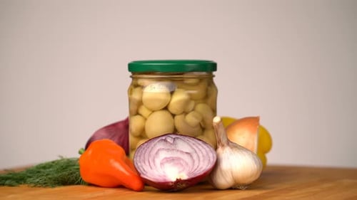 Footage Glass Jars with Salted Vegetables for the Winter Rotated on Table