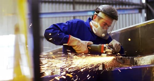 Male engineer using grinder machine 4k