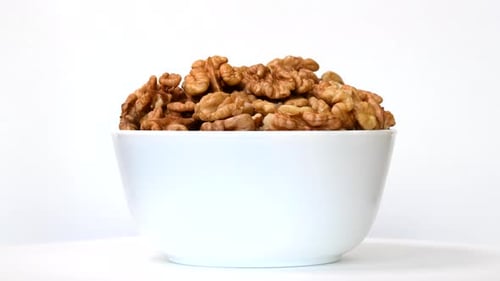 Bowl Filled with Shelled Walnuts Indoors