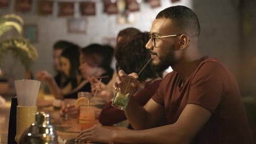 Portrait of Black Man at Bar Counter