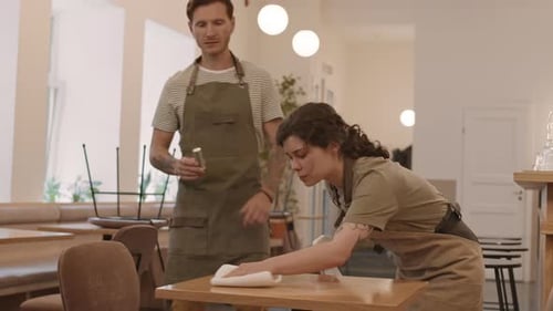 Waiters Preparing Cafe for Opening