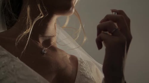 Elegant Bride Sprays Perfume on Wedding Day