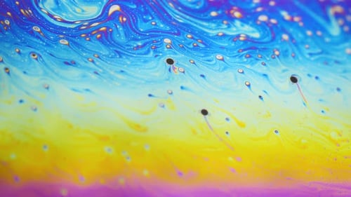 Psychedelic Background of Motion Surface of Colorful Soap Bubble