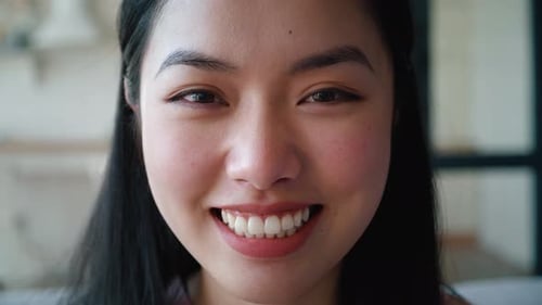 Smiling Young Woman Close Up with Dark Hair