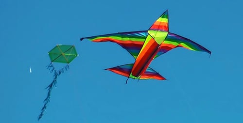 Rainbow Kite Flying in the Clear Blue Sky
