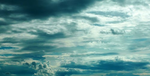 Dramatic Cumulus Clouds Billowing in the Daytime Sky