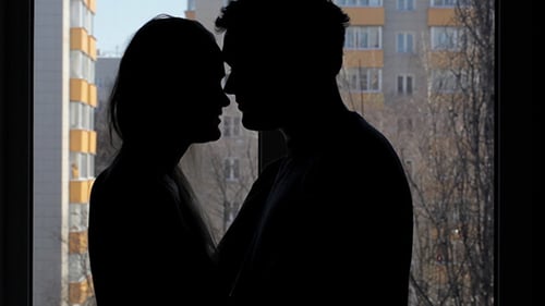 Two Lovers Embracing And Kissing Silhouette
