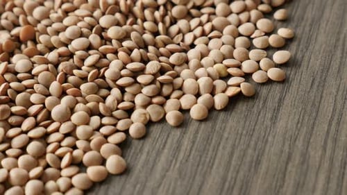 Edible pulse of lentil heap close-up 4K 2160p 30fps UltraHD tilting footage - Healthy Lens esculen