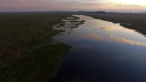 A tranquil twilit sky reflects on water in the Ibera Wetlands, Corrientes Province, Argentina