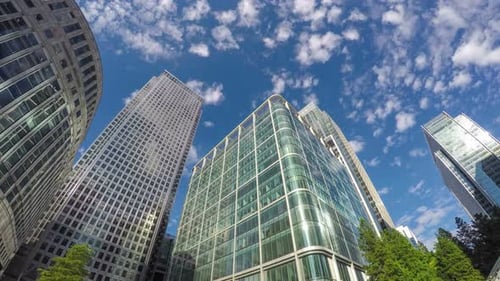 Clouds flying over modern skyscrapers in London, timelapse