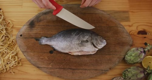 Chef cutting a fish