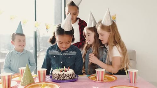 Children Celebrate Birthday With Cake and Party Hats