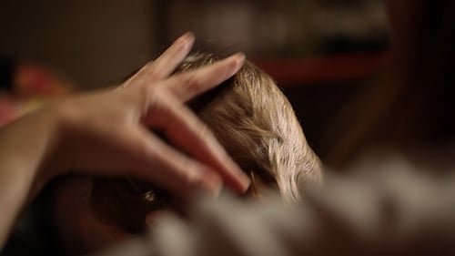 Child Haircut with Scissors and Comb Close Up