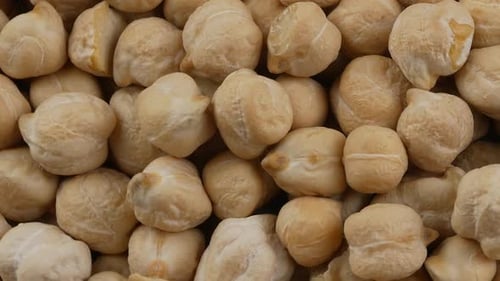 Heap of Tasty Beige Chickpeas Rotating Close Up