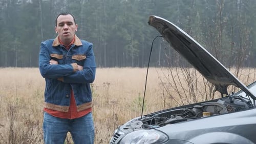 Young Stressed Man Having Trouble with His Broken Car