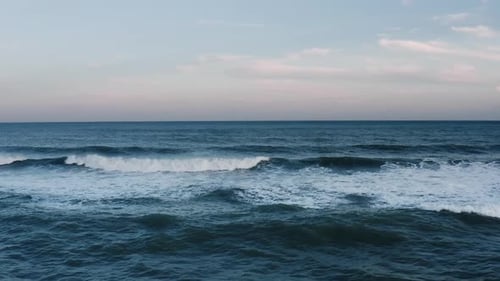 Aerial view of ocean waves in slow motion