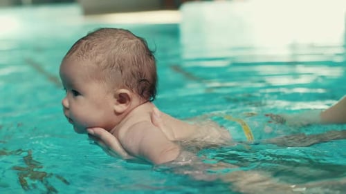 Mother Teach Baby To Swim