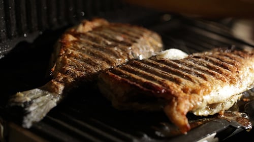 Opening The Grill And Checking Fish