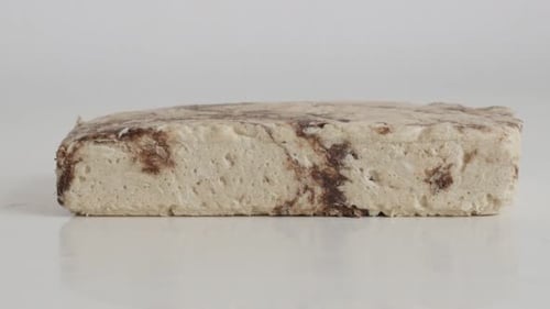 Halva with cocoa and sesame flavor slow tilt 4K video
