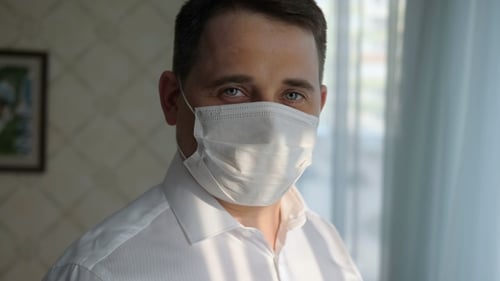 Man Wearing Protective Face Mask Indoors