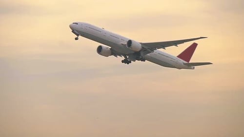 Airplane Taking Off During Sunset