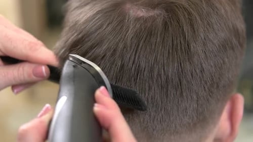 Man Getting Haircut in a Salon, Close Up