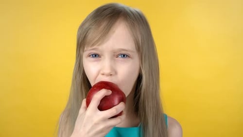 Portrait of Cute Girl Eating Apple