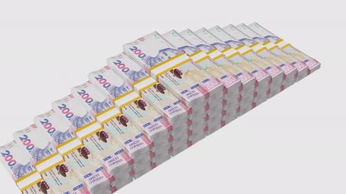 Many wads of money background. 200 Ukrainian Hryvnia banknotes. Stacks of money.