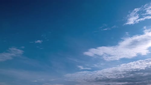 Clouds Drifting Across Vast Blue Sky