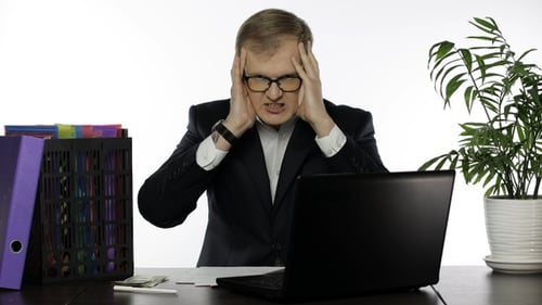 Businessman Working in Office. Shocked Executive Finds Failure Mistake in Work